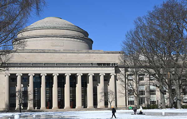 MIT Dome in the winter with snow on the lawn in front