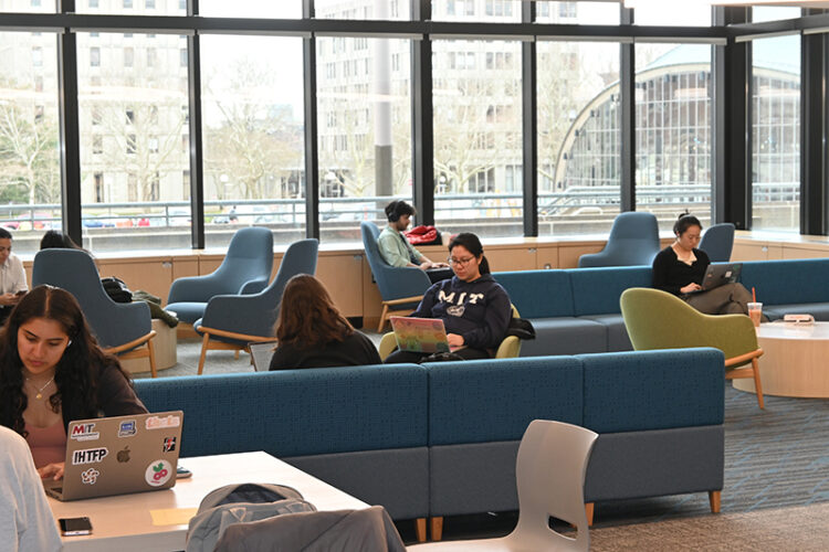 Students sitting in chairs in the Student Center