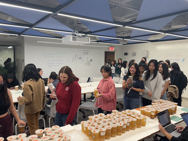Students in line to pick up a tea