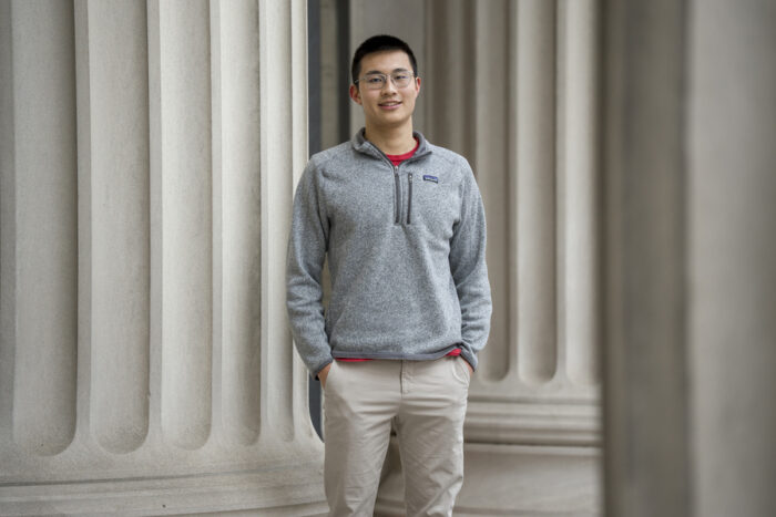 Alex Tang standing on steps near the Great Dome