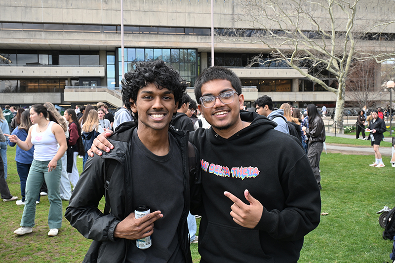 Two students standing outside at Greek Carnival