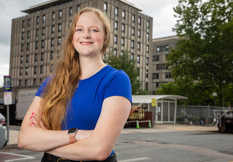 Sydney Baller stands in front of MIT’s McCormick Hall