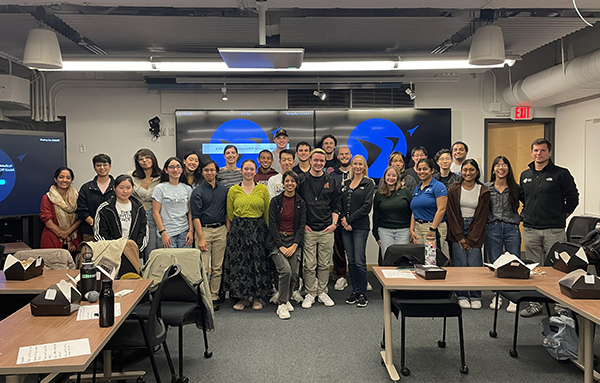 Group photo of students and attendees of the symposium